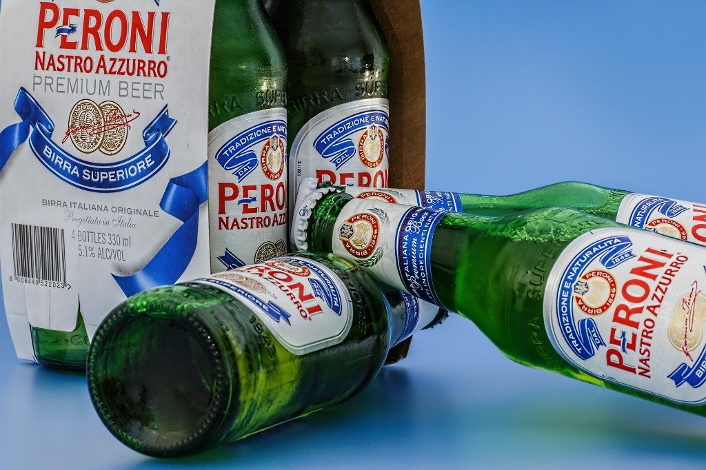 Chilled Peroni Nastro Azzurro beer bottles at Madhuloka